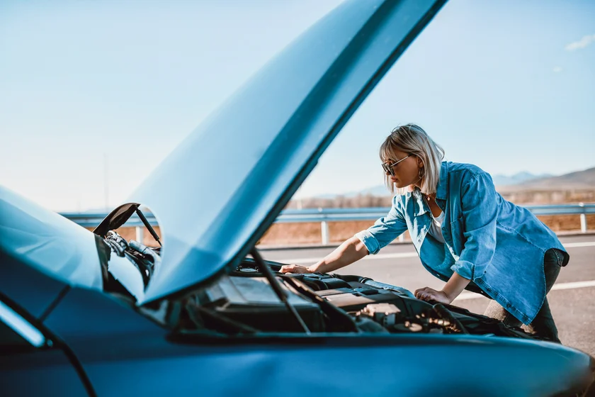 car crash insurance vehicle Credit AleksandarGeorgiev iStock-1314052316 Female Checking Car Water Pressure After Stalling In Road stock photo